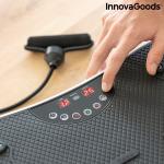 Plateforme vibrante avec accessoires pour les exercices de fitness.